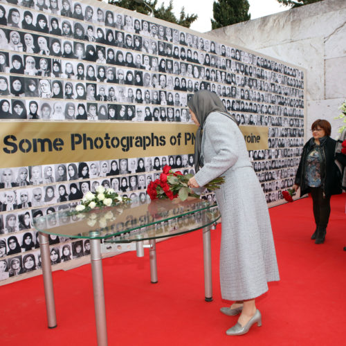 Maryam Rajavi lays flower on the memorial for martyrs