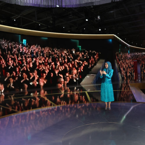 Maryam Rajavi and audience in Free Iran gathering applaud live contact with PMOI freedom-fighters in Albania, Villepinte, July 1, 2017