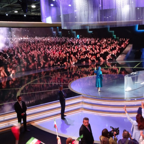 Maryam Rajavi and audience in Free Iran gathering applaud live contact with PMOI freedom-fighters in Albania, Villepinte, July 1, 2017