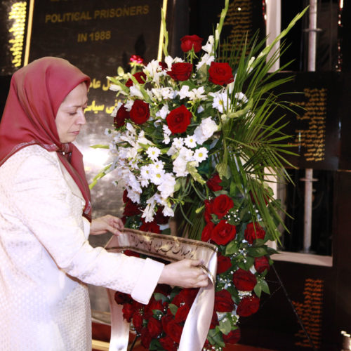 Laying flowers at the monument in memory of 30,000 victims of 1988 massacre, symbols of honor and resistance of the people of Iran