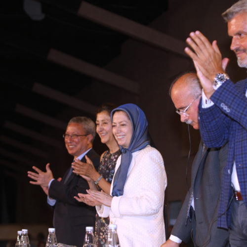 From left, Tahar Boumedra, Ingrid Betancourt, Maryam Rajavi, Italian Sentor Pietro Liuzzi, and Mariano Rabino, Italian MP applaud during a ceremony in Tirana, Albania, commemorating victims of 1988 massacre.
