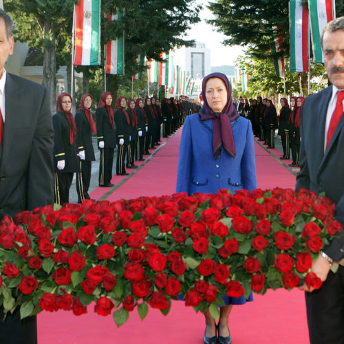 Maryam Rajavi lays flowers for martyrs of of the rocket attack on October 29, 2015 on Camp Liberty – October 2016
