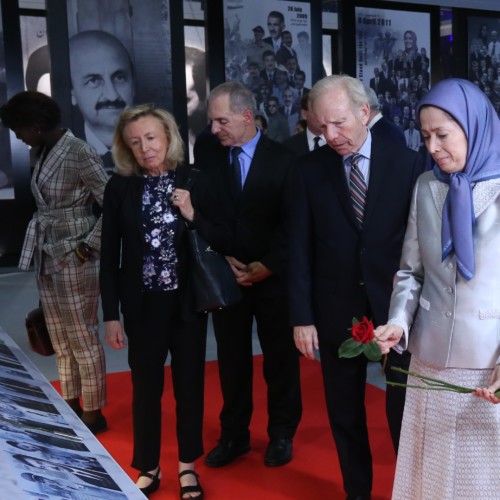 Laying flowers on the photos of martyrs of the massacre in Ashraf on September 1, 2013- July 12, 2019