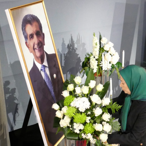 Putting flowers for Samad Sajedian, a member of PMOI who recently passed away