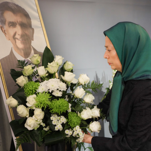 Putting flowers for Samad Sajedian, a member of PMOI who recently passed away