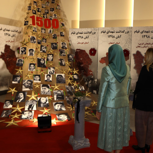 Maryam Rajavi, Monika Kryemadhi and her accompanying delegation visit the exhibition of 120 years of the Iranian people’s struggle for freedom - standing beside the memorial of 1,500 martyrs of the Iran Uprising in November 2019
