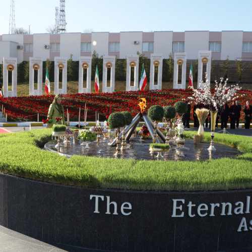 Maryam Rajavi standing beside the New Year Haft Sin arrangement and the beacon of freedom, Nowruz 1399