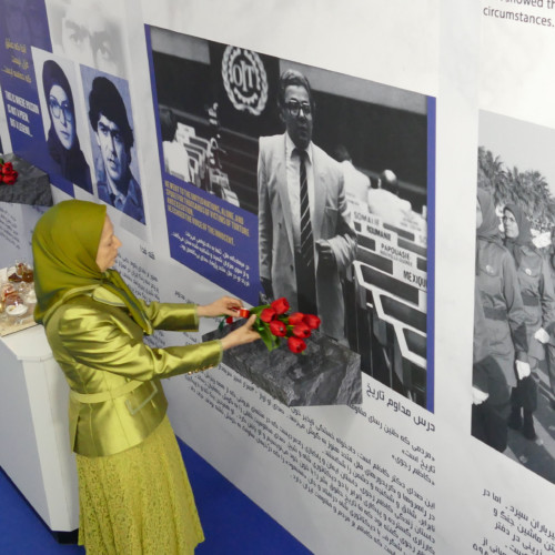 In her New Year visit to the Exhibition of the Iranian People’s 120 Years of Struggle for Freedom, Maryam Rajavi lays flowers at the protrait of Prof. Kazem Rajavi, the great martyr for human rights