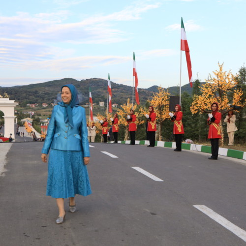 Maryam Rajavi standing in front of monument dedicated to Iran uprising and youth rising up against the mullahs’ dicatorship – Ashraf 3, July 17, 2020.