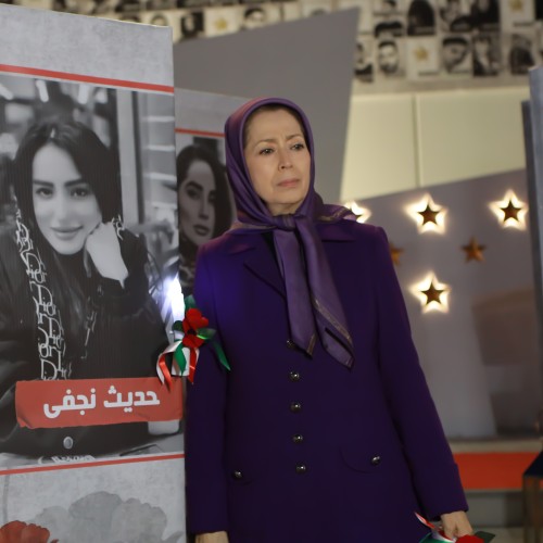 Standing by the portrait of Hadis Najafi, the young woman killed by Khamenei’s forces during the Iran uprising.