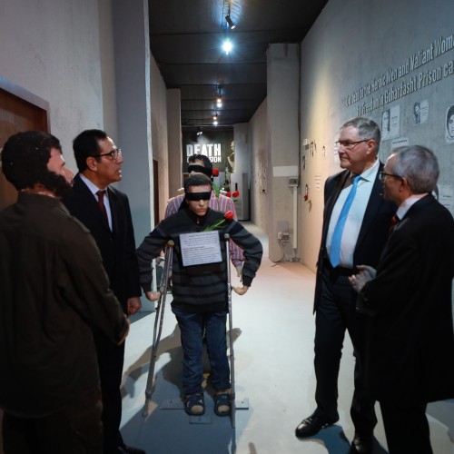 Franz-Josef Jung and Liam Fox tour the Resistance’s Museum during their visit to Ashraf-3