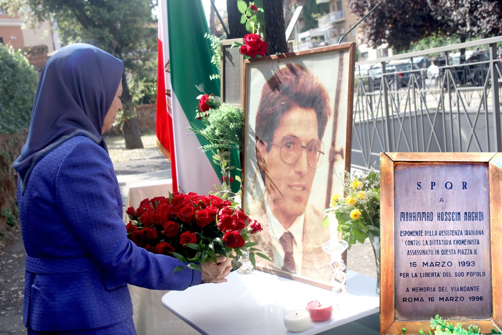 Laying flowers at the location where the representative of the National Council of Resistance of Iran in Italy, Mohammad Hossein Naghdi